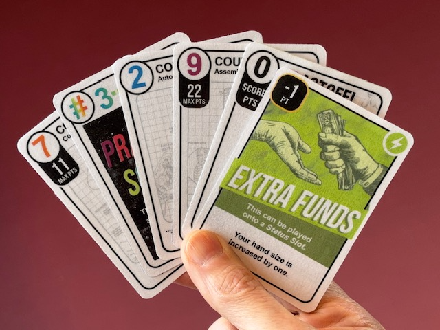 A hand holding countdown cards